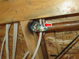 Electrical cables touching copper supply line